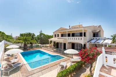 an aerial view of a house with a swimming pool at Quinta da Liberdade in Luz