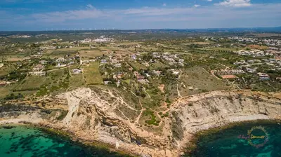 an aerial view of a village on a cliff near the ocean at Quinta da Liberdade in Luz