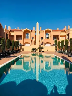 a large swimming pool in front of a building at Luz Beach Luxury Apartment in Luz