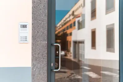 an elevator with a metal door in a building at OurMadeira - Aguia in Funchal
