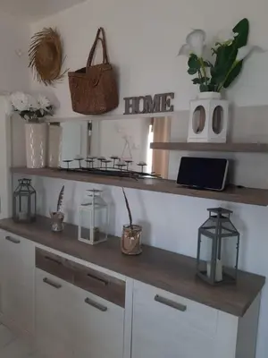 a room with a wooden shelf with a laptop on it at AMAZING PENTHOUSE- panoramic sea view & tikki bar on private terrasse in Luz