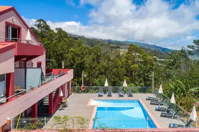 a resort with a swimming pool on a building at Quinta Frizado in Prazeres