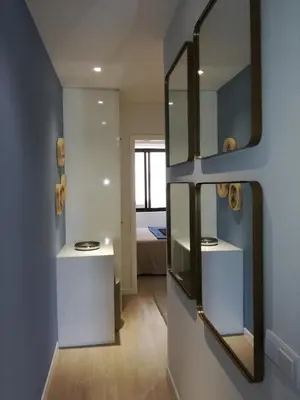 a dressing room with a mirror on the wall at BAYLEAF Apartments - Apartamento do Tempo in Funchal