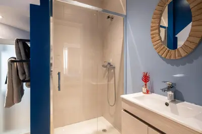 a bathroom with a shower and a sink at BAYLEAF Apartments - Apartamento do Tempo in Funchal