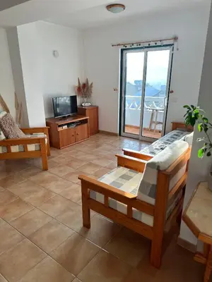 a living room with a view of the ocean at Luz Paradise in Luz