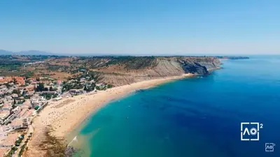 an aerial view of a beach and the ocean at Luz Paradise in Luz
