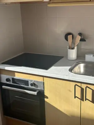 a kitchen with a stove and a sink at Luz Paradise in Luz