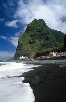 a view of a beach with a mountain in the background at A Casa da Avó... in São Vicente