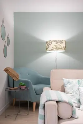 a living room with a blue couch and a table at BAYLEAF Apartments - Casa D'Avó in Funchal