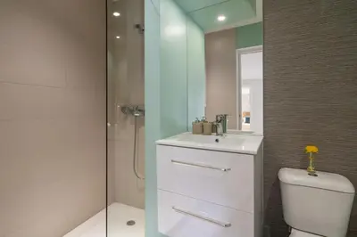 a bathroom with a toilet and a sink and a shower at BAYLEAF Apartments - Casa D'Avó in Funchal
