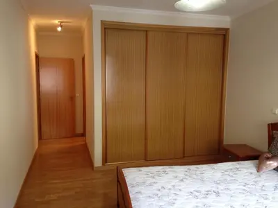 a bedroom with a bed and a large closet at Bento Lodge by Madeira Holiday Rentals in Ribeira Brava