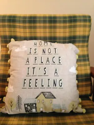 a pillow that says not a place its a feeling at Bento Lodge by Madeira Holiday Rentals in Ribeira Brava
