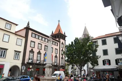 a city street with buildings and a clock tower at Edificio Charles 102 in Funchal