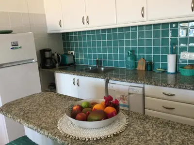 a bowl of fruit on a counter in a kitchen at DOCEVIDA Appartement # Ocean View in Salema
