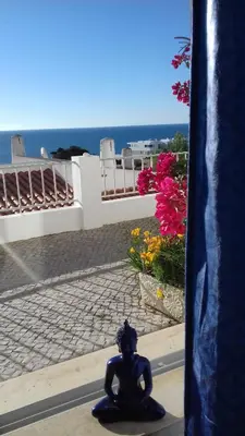 a statue sitting on the side of a street at DOCEVIDA Appartement # Ocean View in Salema