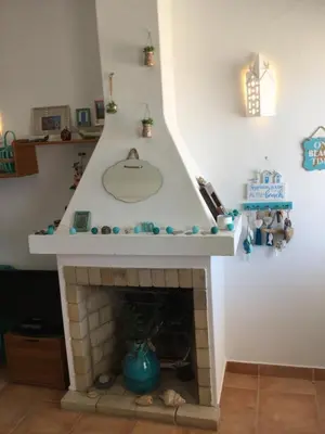a fireplace with a sink on top of it at DOCEVIDA Appartement # Ocean View in Salema