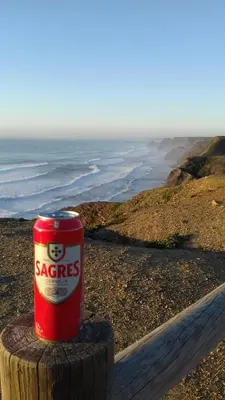 a can of sopes sitting on top of a pole on the beach at DOCEVIDA Appartement # Ocean View in Salema