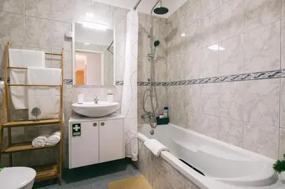 a bathroom with a sink and a tub and a toilet at Pereira Place in São Vicente