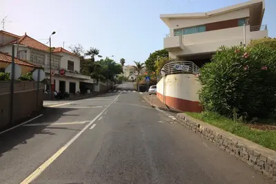 an empty street with a boat on the side of a building at Villas Quinta da Lapa by AnaLodges in Câmara de Lobos