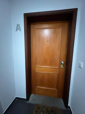 a wooden door in the middle of a hallway at Villas Quinta da Lapa by AnaLodges in Câmara de Lobos