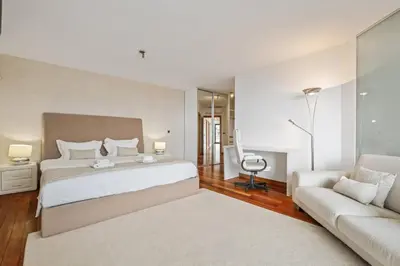 a living room with a table and a couch at Villa Beausoleil by Homie in Funchal
