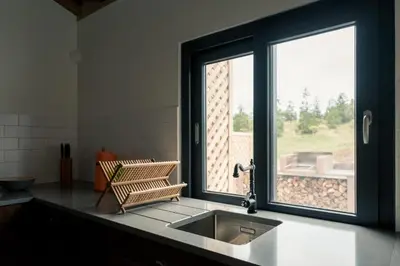 a kitchen with a sink and a window at Quinta de São José in São Pedro