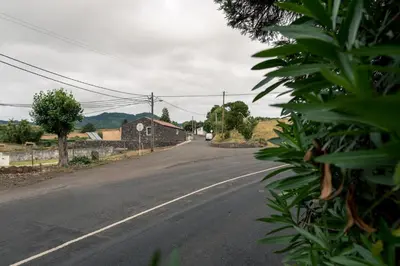 a pool of water next to a building at Quinta de São José in São Pedro