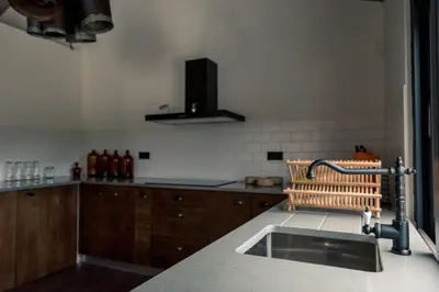 a bathroom with a sink and a towel on a wooden floor at Quinta de São José in São Pedro