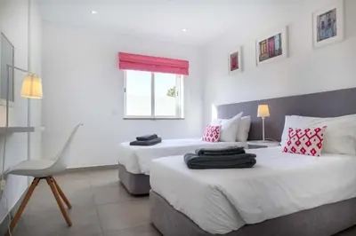 a bathroom with a white toilet and a tub and a toilet at Waterside 3 Bedroom Sea view in Luz