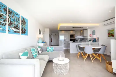 a living room with a couch and a table at Waterside 3 Bedroom Sea view in Luz