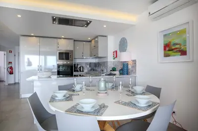 a living room with a couch and a television at Waterside 3 Bedroom Sea view in Luz