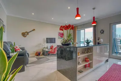 a living room with a couch and a table at Pérola - Madeira Inn Group in Funchal