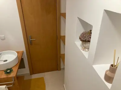 a bathroom with a sink and a toilet at Casa do Atlântico in Funchal