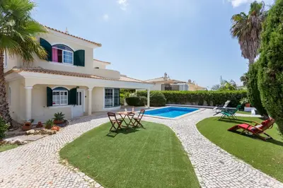 a house with a yard with a swimming pool at Villa Paraiso da Luz by Seewest in Luz