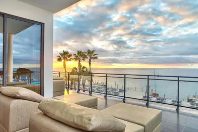 a living room with a view of the ocean at VidaMar Resort Hotel Madeira in Funchal