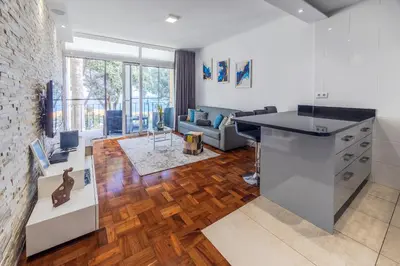 a kitchen and living room with a counter top at Sea Breeze I in Caniço