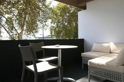 a balcony with a table and chairs and the ocean at Florasol Residence Hotel - Dorisol hotels in Funchal