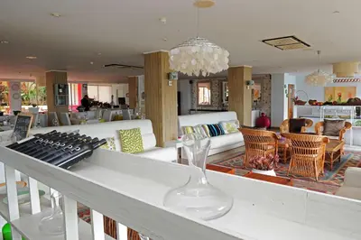 a living room with a table with a keyboard at Florasol Residence Hotel - Dorisol hotels in Funchal