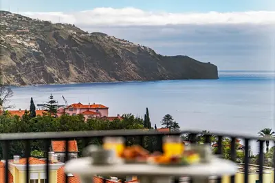 a view of the ocean from a balcony at Dorisol Buganvilia Studio Hotel in Funchal