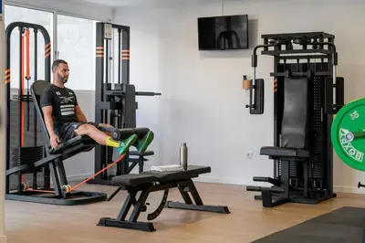 a man in a gym sitting on a treadmill at Dorisol Buganvilia Studio Hotel in Funchal