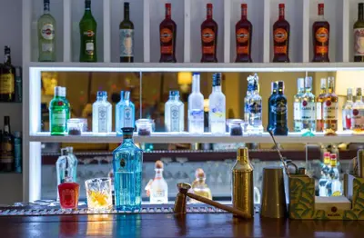 a bar with a lot of bottles of alcohol at Dorisol Estrelicia Hotel in Funchal