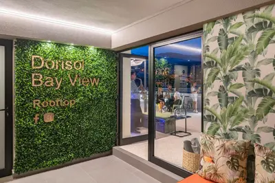 a store front with a green wall in a store at Dorisol Mimosa Studio Hotel in Funchal
