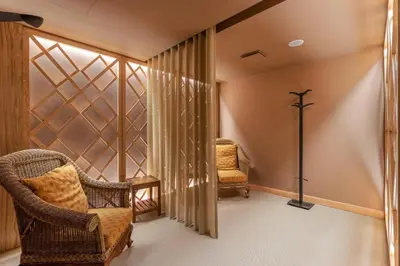 a room with two chairs and a window at Royal Savoy - Ocean Resort - Savoy Signature in Funchal