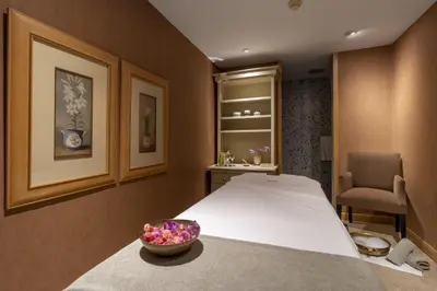 a bedroom with a bed and a bowl of flowers at Royal Savoy - Ocean Resort - Savoy Signature in Funchal