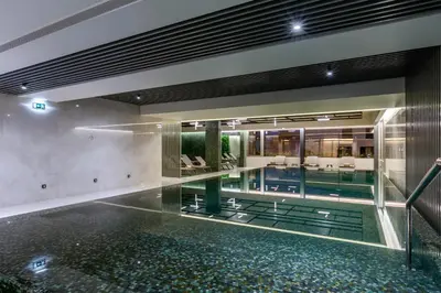 a swimming pool in a building with a lobby at TUI Blue Gardens - Adults-only - Savoy Signature in Funchal