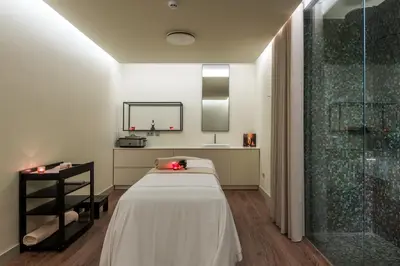 a hospital room with a bed and a shower at TUI Blue Gardens - Adults-only - Savoy Signature in Funchal