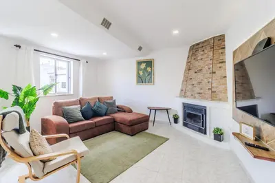 a living room with a couch and a fireplace at Casa da Avó in Espiche