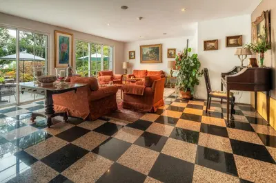 a living room with a checkered floor at Quintinha Sao Joao Hotel & Spa in Funchal