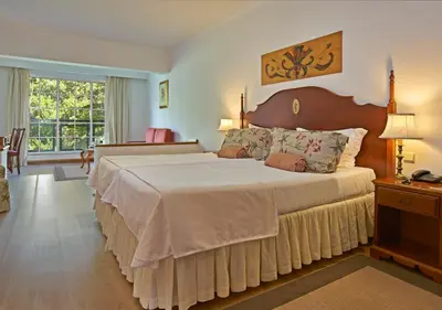 a bedroom with a large bed and a window at Quintinha Sao Joao Hotel & Spa in Funchal
