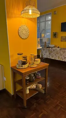 a table with a menu and a lamp on it at Monte Verde in Funchal